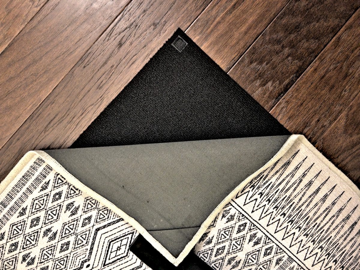 a rug on a wood floor