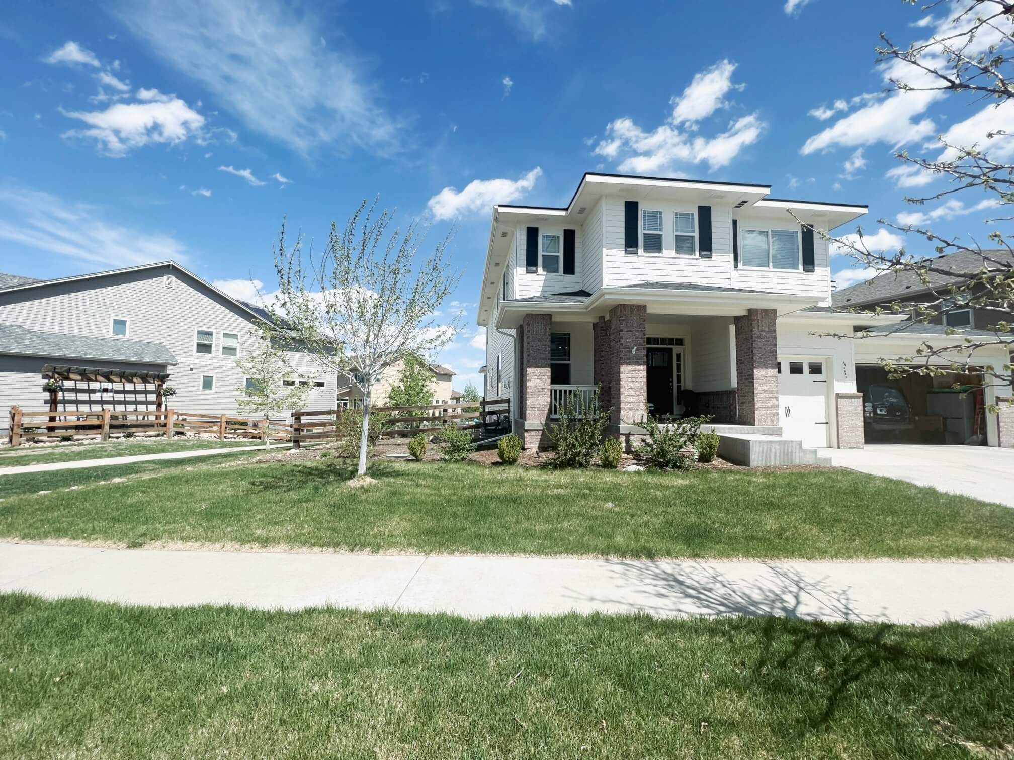 a house with a lawn and a driveway
