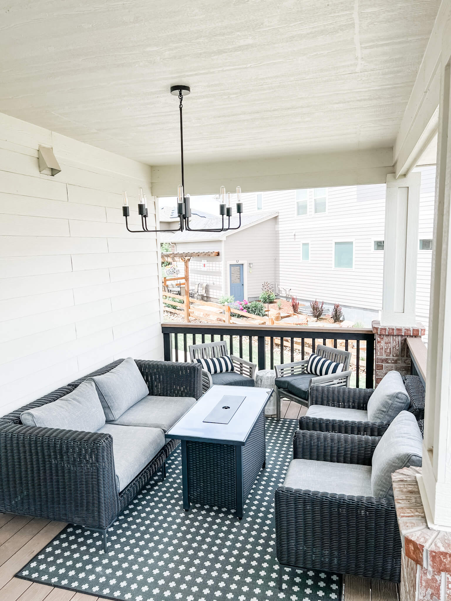 a patio with a table and chairs
